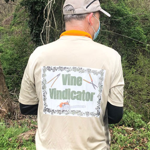 volunteer wearing vine vindicator t-shirt